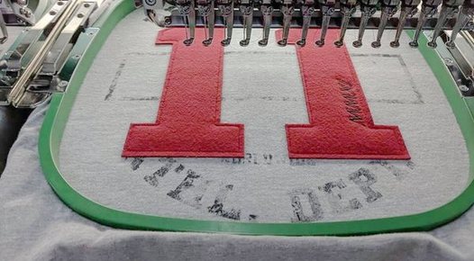 Multi-head embroidery production
